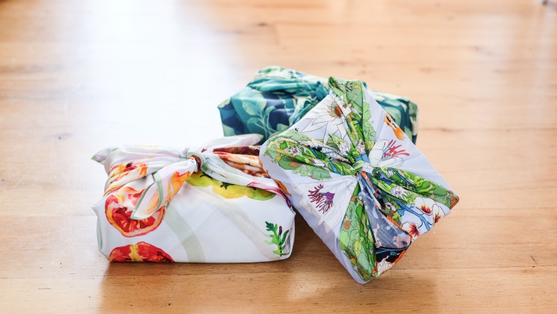 a pile of 3 boxes wrapped in pretty fabric